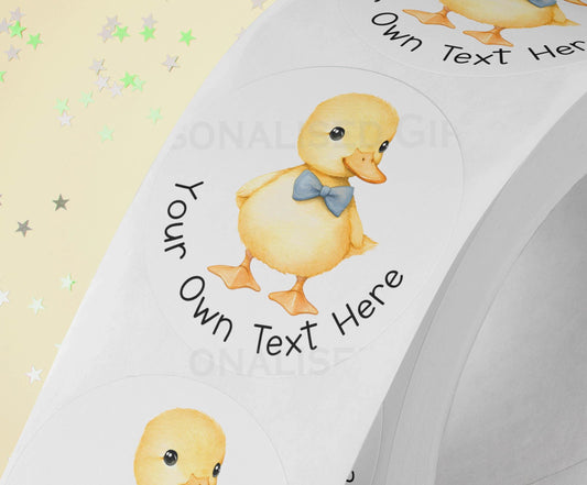 Personalised yellow duck sticker with blue bow design, printed on a strip of three, 5cm high gloss