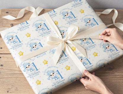 Gift wrapped in personalised baby snowman Christmas paper, tied with a cream ribbon and printed with Happy Christmas, To My Grandson, William and the age 1