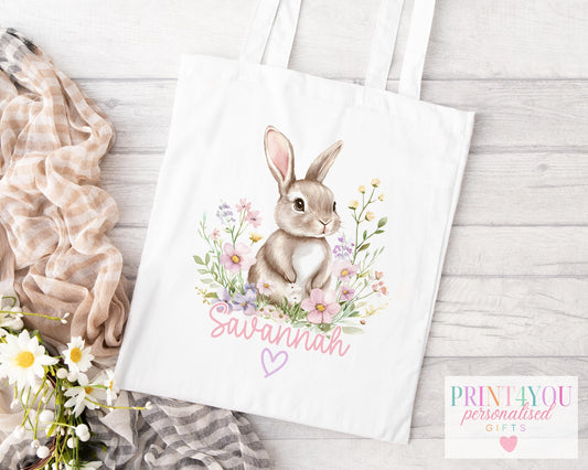 Personalised cotton tote bag printed with an illustrated bunny among wildflowers and a custom name