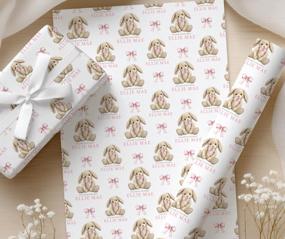 Personalised pink bunny wrapping paper wrapped around a newborn gift box
