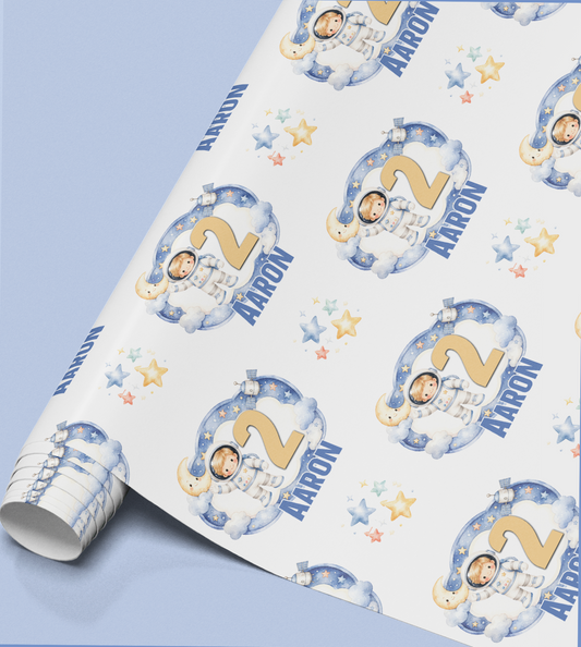 Full repeat pattern of the personalised galaxy wrapping paper design showing stars and planets