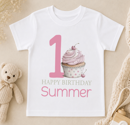 Personalised t-shirt printed with a pink cupcake, number one and 'Happy Birthday Summer' lettering
