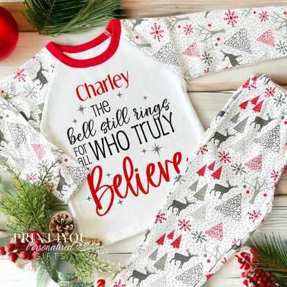 Child wearing personalised reindeer print Christmas pyjamas with Believe design, size 1-2 years