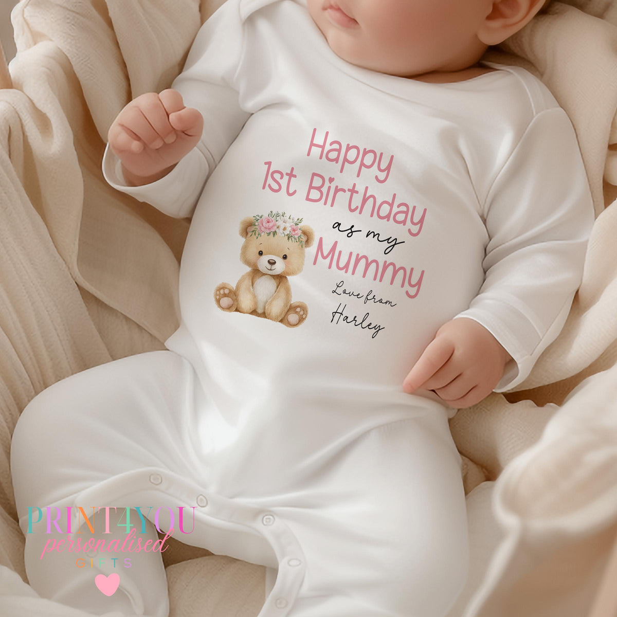 Personalised 'Happy 1st Birthday as my Mummy' sleepsuit with a teddy bear in a flower crown and custom name