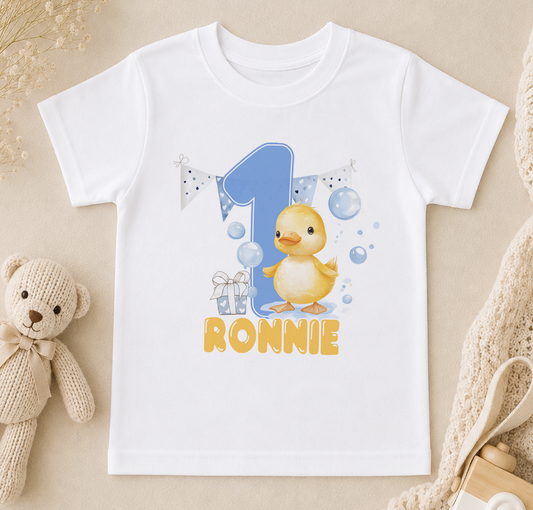 White t-shirt printed with a cartoon duck, a number 1 and the personalised name 'Ronnie'.