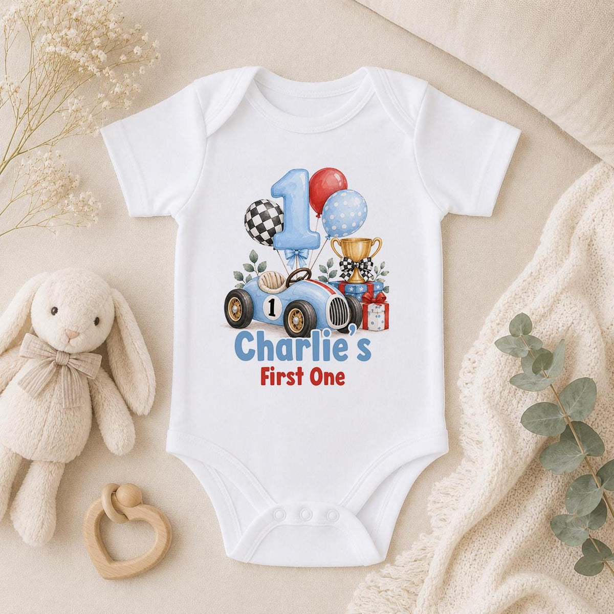 Personalised race car first birthday baby vest with number 1 and Charlie's First One