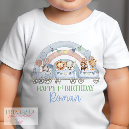 Personalised first birthday outfit printed with a safari train and rainbow design, safari animals and the child's custom name.