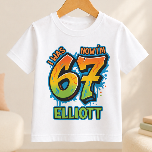 White t-shirt with bold graffiti-style number 7 design personalised with the name Elliott for a boy's 7th birthday