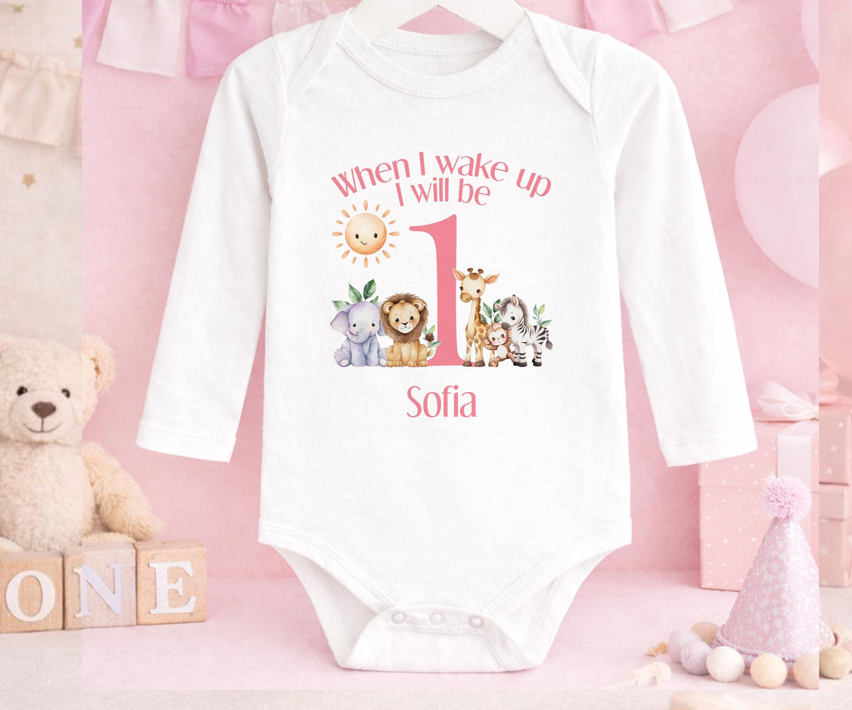Close-up of the safari design and custom name print on pink 1st birthday pyjamas