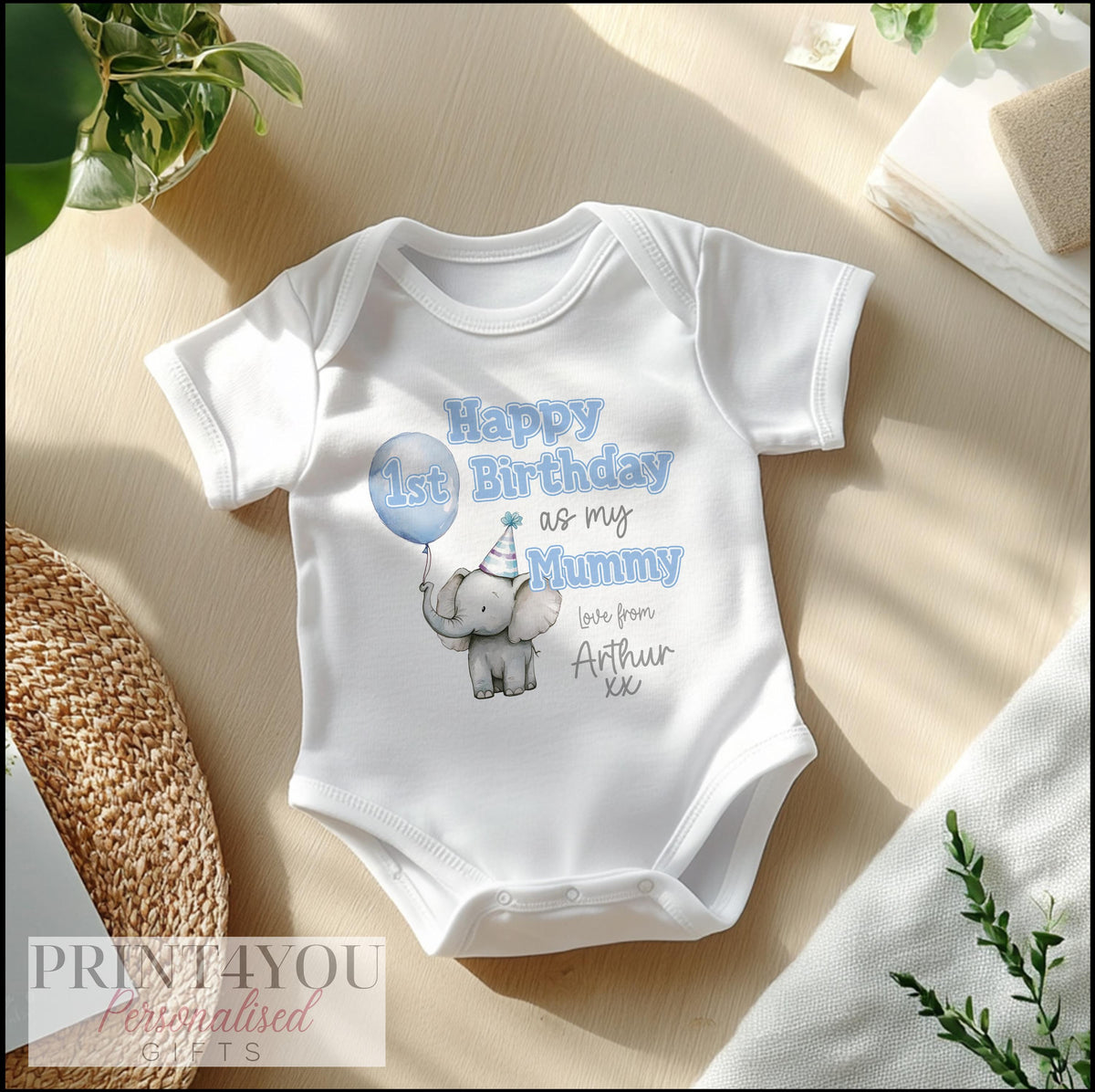 Close-up of the Cute Elephant birthday print with a blue balloon and personalised name.
