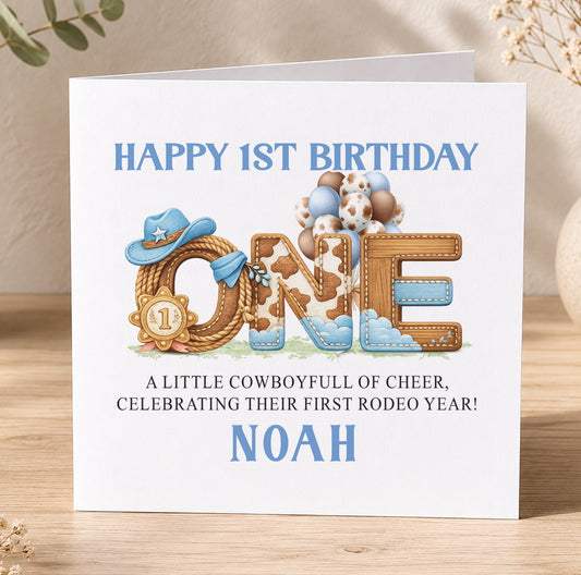 Rodeo-themed 1st birthday card spelling out 'ONE' with a cowboy hat, balloons and ribbon, personalised for Noah's first birthday.