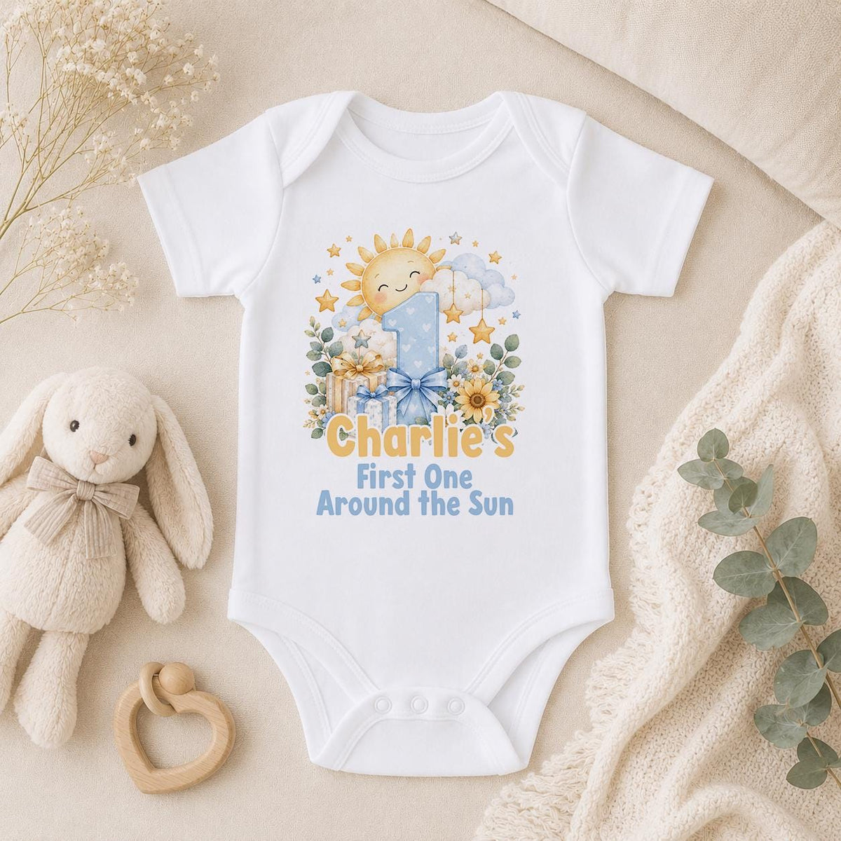 Personalised First One Around the Sun first birthday baby vest with the name Charlie