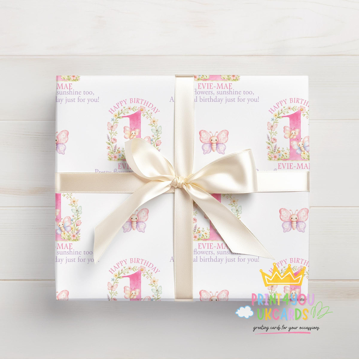 Gift wrapped in the personalised pink butterfly wrapping paper, tied with ribbon.