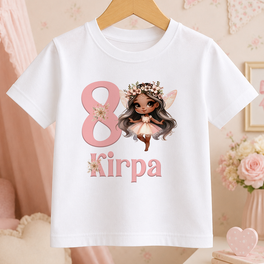 White children's t-shirt printed with a pink fairy design, a large personalised age number, and a custom name in pink script