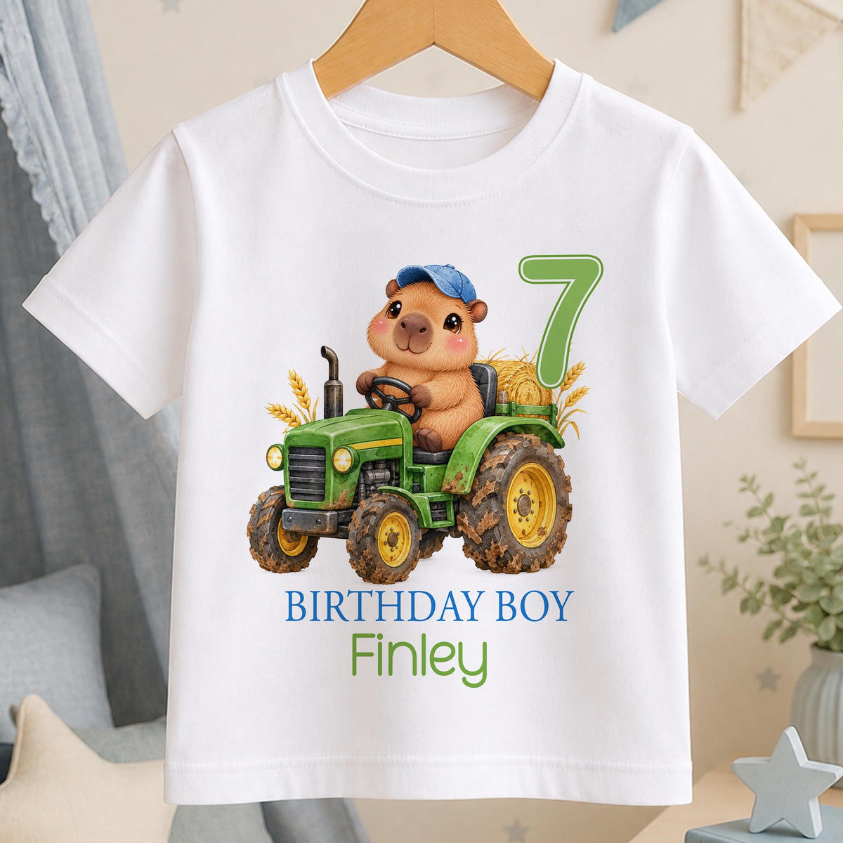 Personalised capybara tractor birthday t-shirt – white tee with a capybara driving a green tractor, green number 7, Birthday Boy and the name Finley