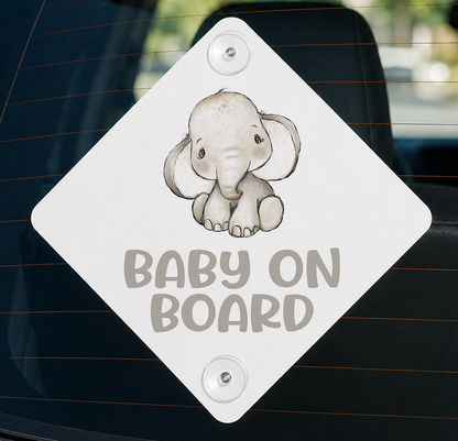 Aluminium car window sign printed with a baby elephant safari design and the words 'Baby on Board'.