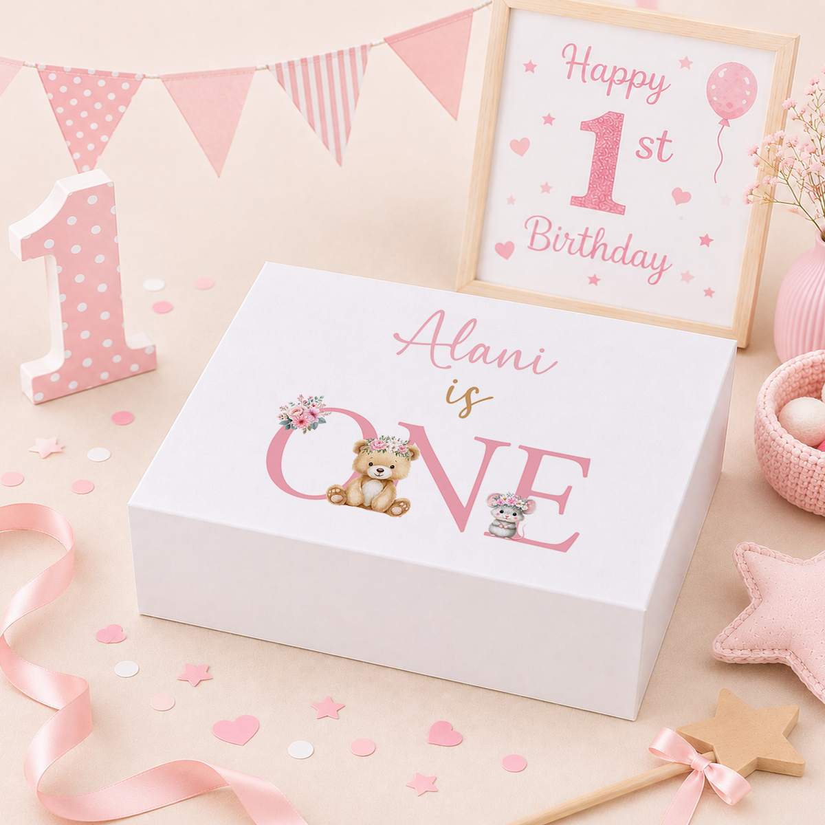 Pink teddy bear first birthday keepsake box with magnetic lid, floral-crowned teddy bear and mouse design, personalised with child's name reading '[Name] is ONE'