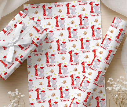 Personalised Baby's First Christmas elephant wrapping paper wrapped around a gift