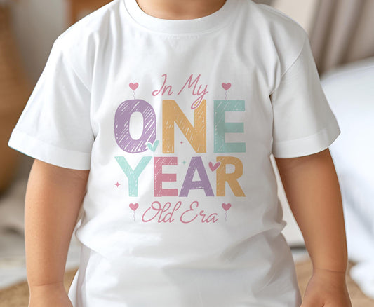 Baby wearing a white cotton birthday t-shirt personalised with an age number from 1 to 8, size 6-12 months