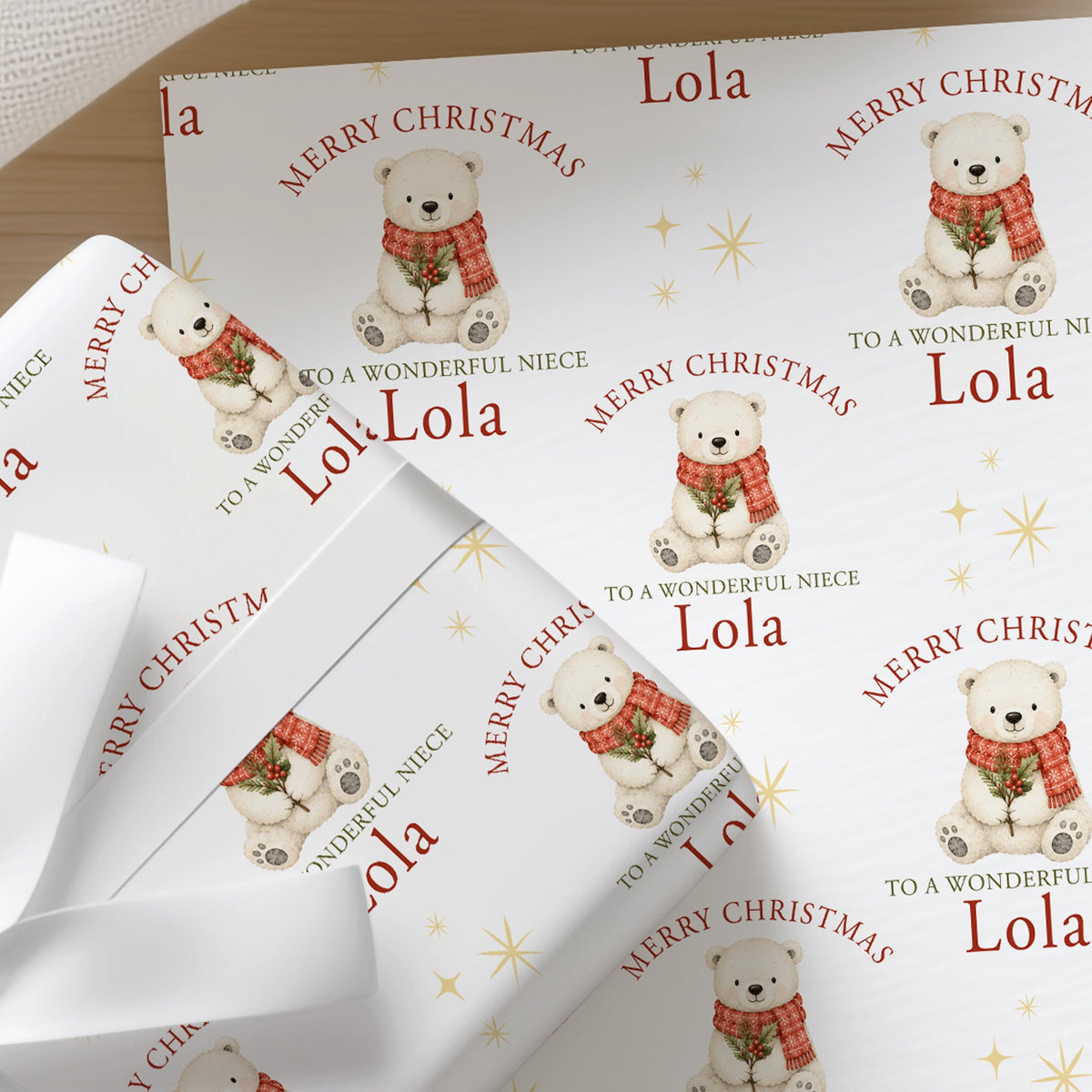 Personalised Christmas wrapping paper featuring a friendly polar bear with holly and a festive red scarf, custom name and relation.