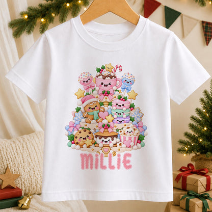 Personalised kawaii Christmas tree t-shirt – white tee with pastel sweet treats stacked into a Christmas tree, with the name Millie in pink