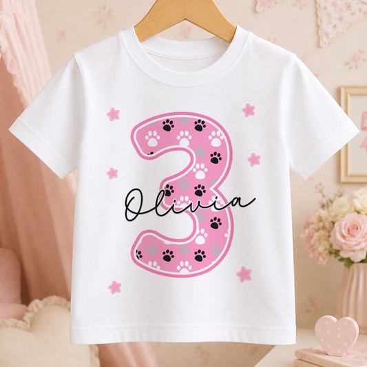 White cotton kids t-shirt personalised with name, pink number and paw print birthday design