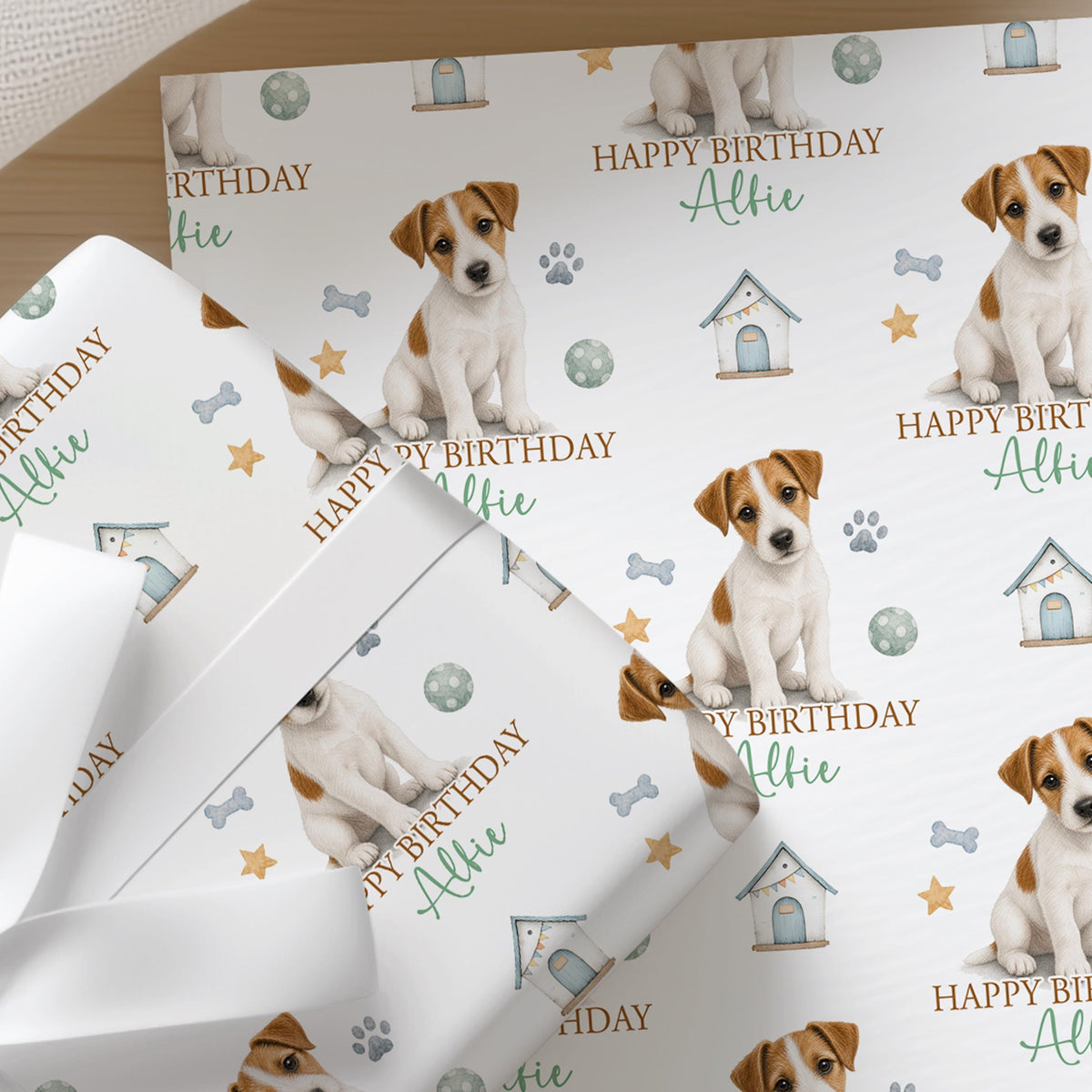 Close-up of the personalised Jack Russell wrapping paper showing the terrier illustration and custom name detail.