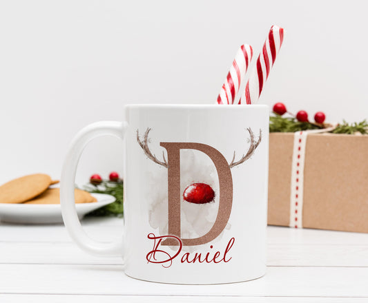 Personalised white ceramic mug with red-nosed reindeer design and custom initial, boys Christmas stocking filler