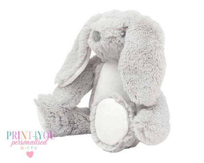Personalised bunny cushion styled on a child's bed with velvet bunny toy