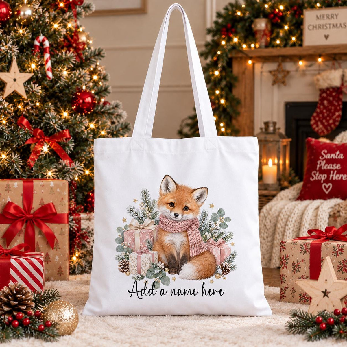 White cotton tote bag printed with a watercolour fox in a blush pink scarf among pink presents, above a personalised name