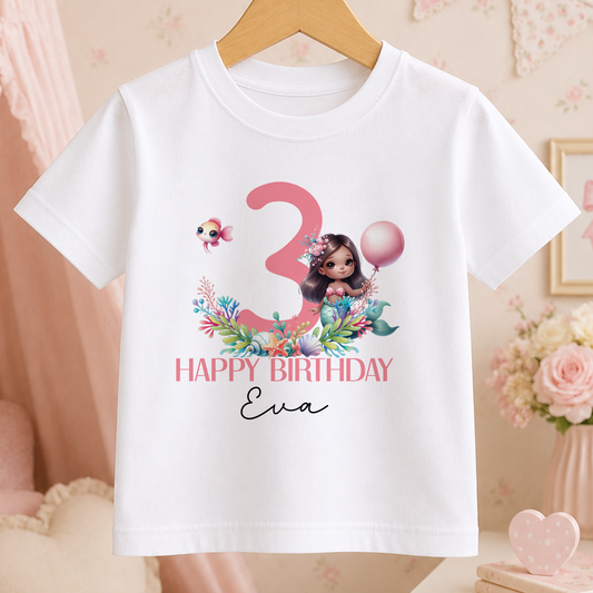 White kids t-shirt with a pink printed age number and a mermaid character design