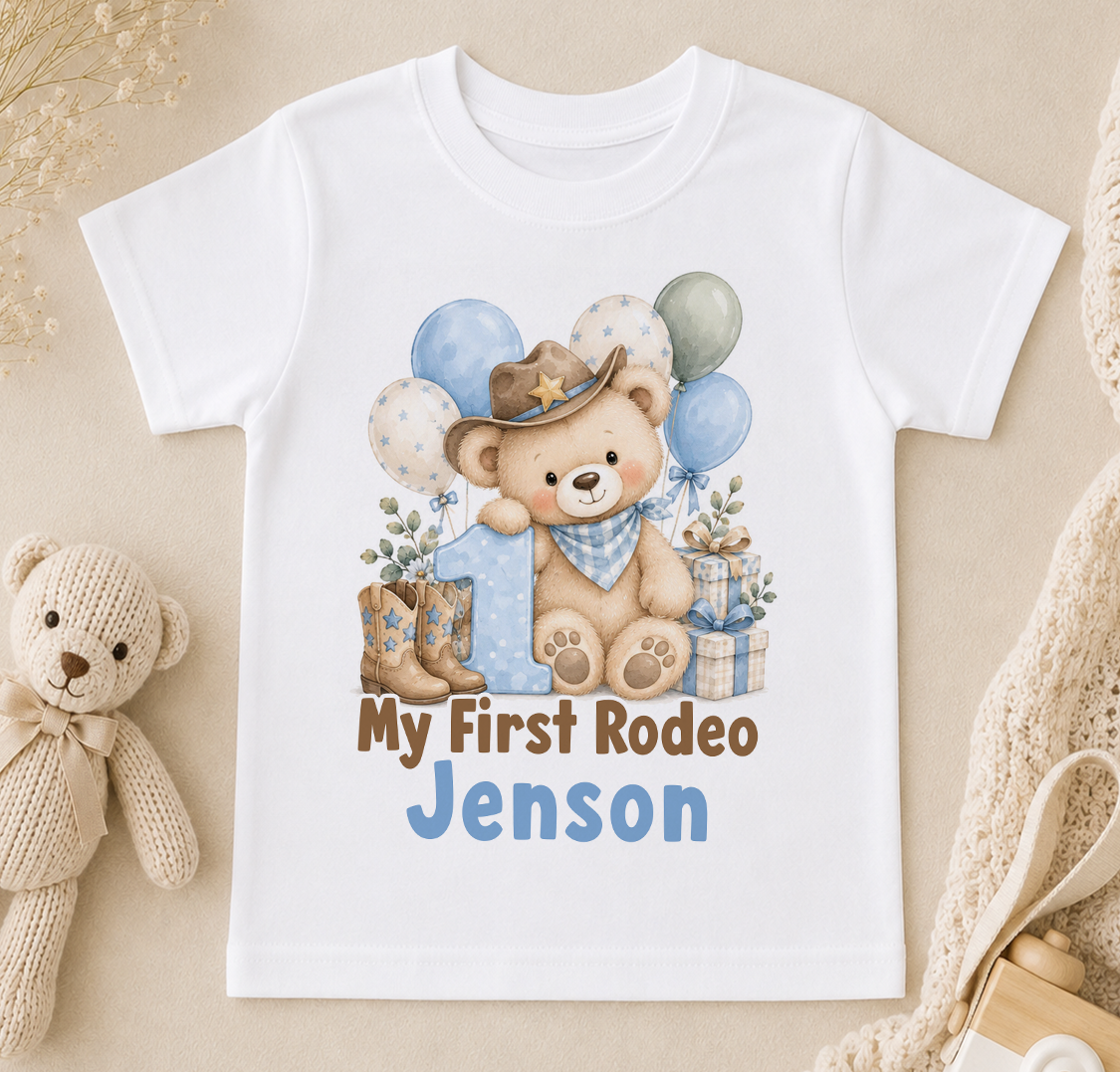 Personalised My First Rodeo first birthday t-shirt – cowboy teddy bear with number 1, balloons and the name Jenson