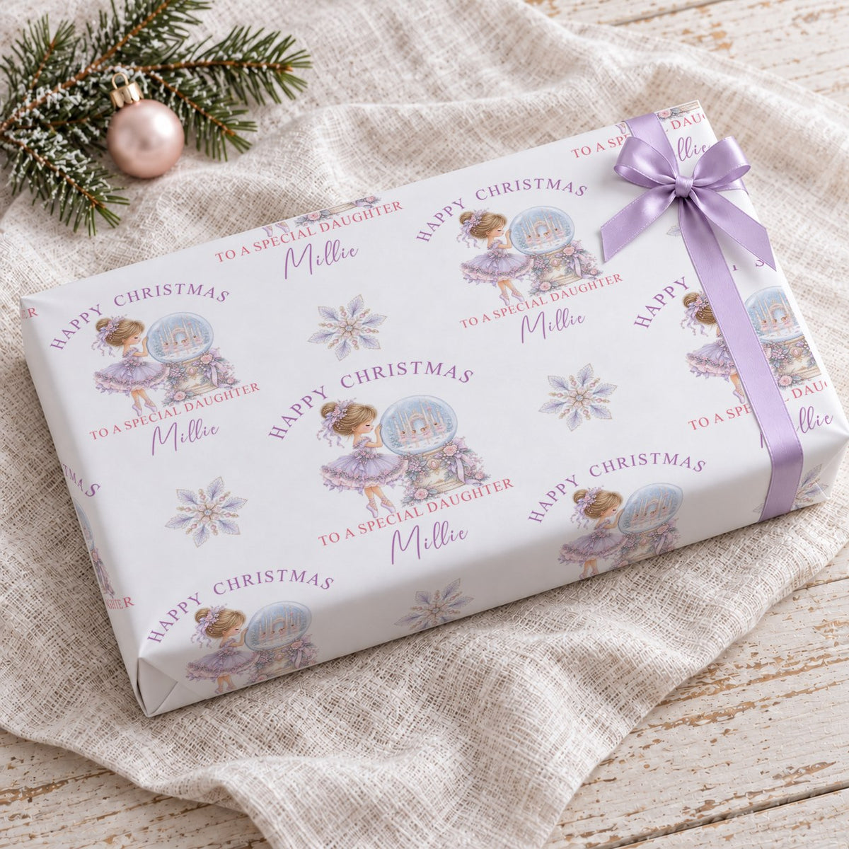 Present wrapped in personalised pastel ballerina To A Special Daughter wrapping paper with a pink bow
