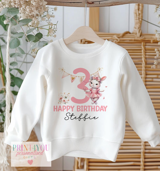 White cotton sweatshirt printed with a personalised ballerina bunny design, name and birthday number.