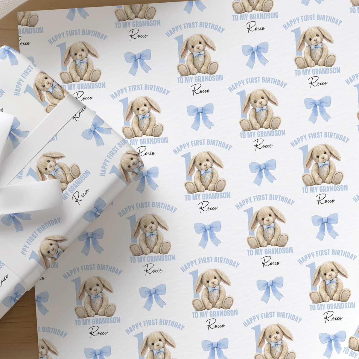 Soft pastel blue wrapping paper printed with a rabbit birthday design, personalised with a custom name for a grandson.