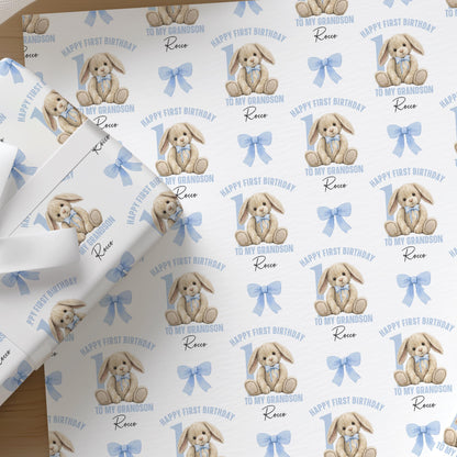 Soft pastel blue wrapping paper printed with a rabbit birthday design, personalised with a custom name for a grandson.