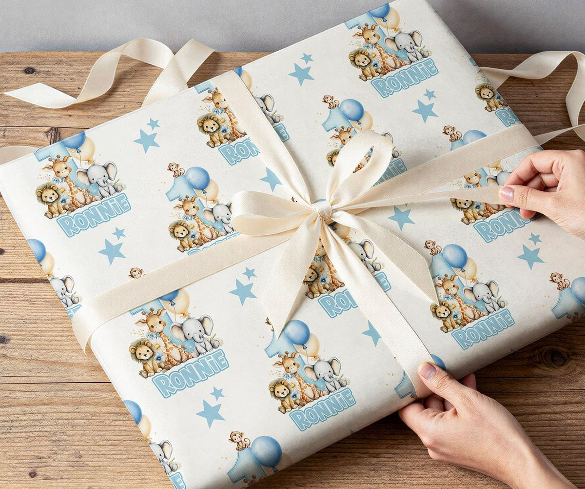Personalised blue safari wrapping paper rolled and shown against a plain background