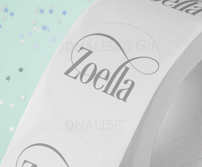 Personalised colourful festive name stickers on an A4 sheet of 24, glossy 4.5cm round gift labels