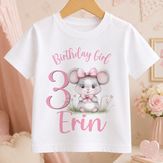 White children's t-shirt printed with a pink mouse illustration, personalised with the child's name and birthday age number, for a girls birthday party or cake smash.