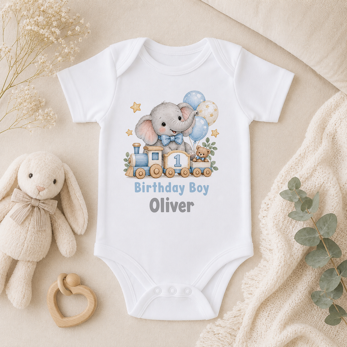 Personalised elephant train first birthday baby vest with Birthday Boy Oliver
