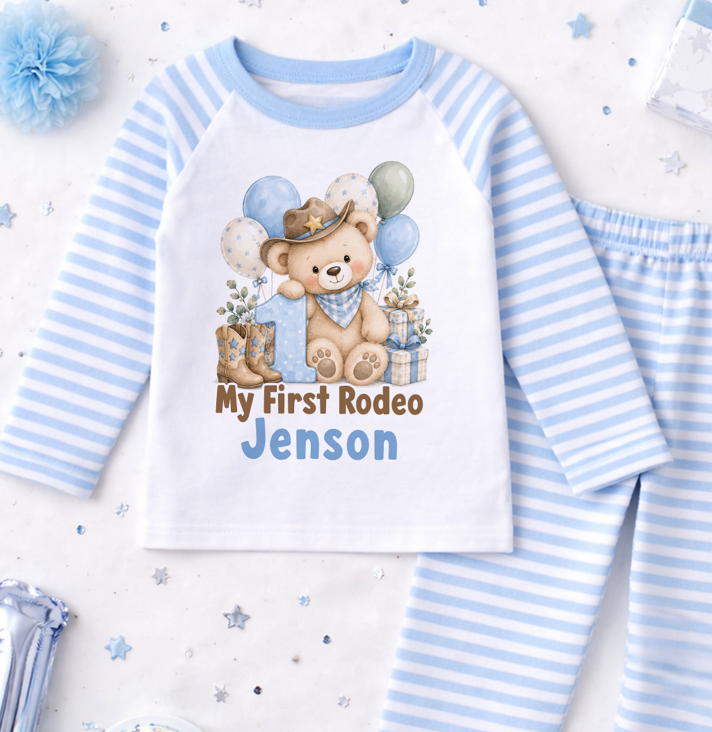 Personalised 1st birthday pyjamas, My First Rodeo Cowboy Teddy design with name, blue and white striped