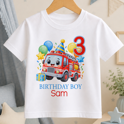 Personalised birthday t-shirt with a cartoon red fire engine in a party hat surrounded by balloons, printed with the age number 3 and the name Sam under BIRTHDAY BOY.