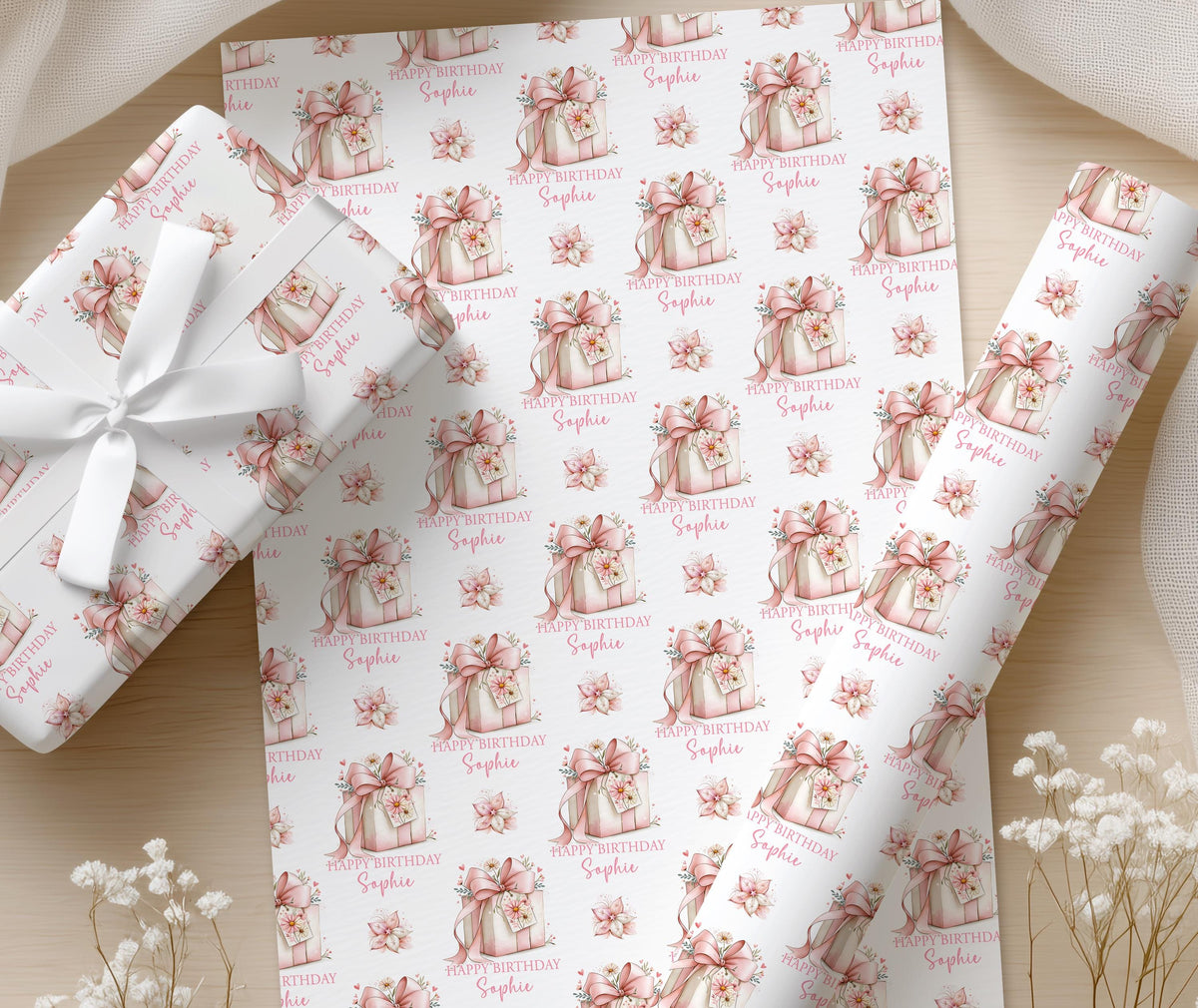 Personalised pink floral wrapping paper shown wrapped around a gift box to demonstrate the finished look.