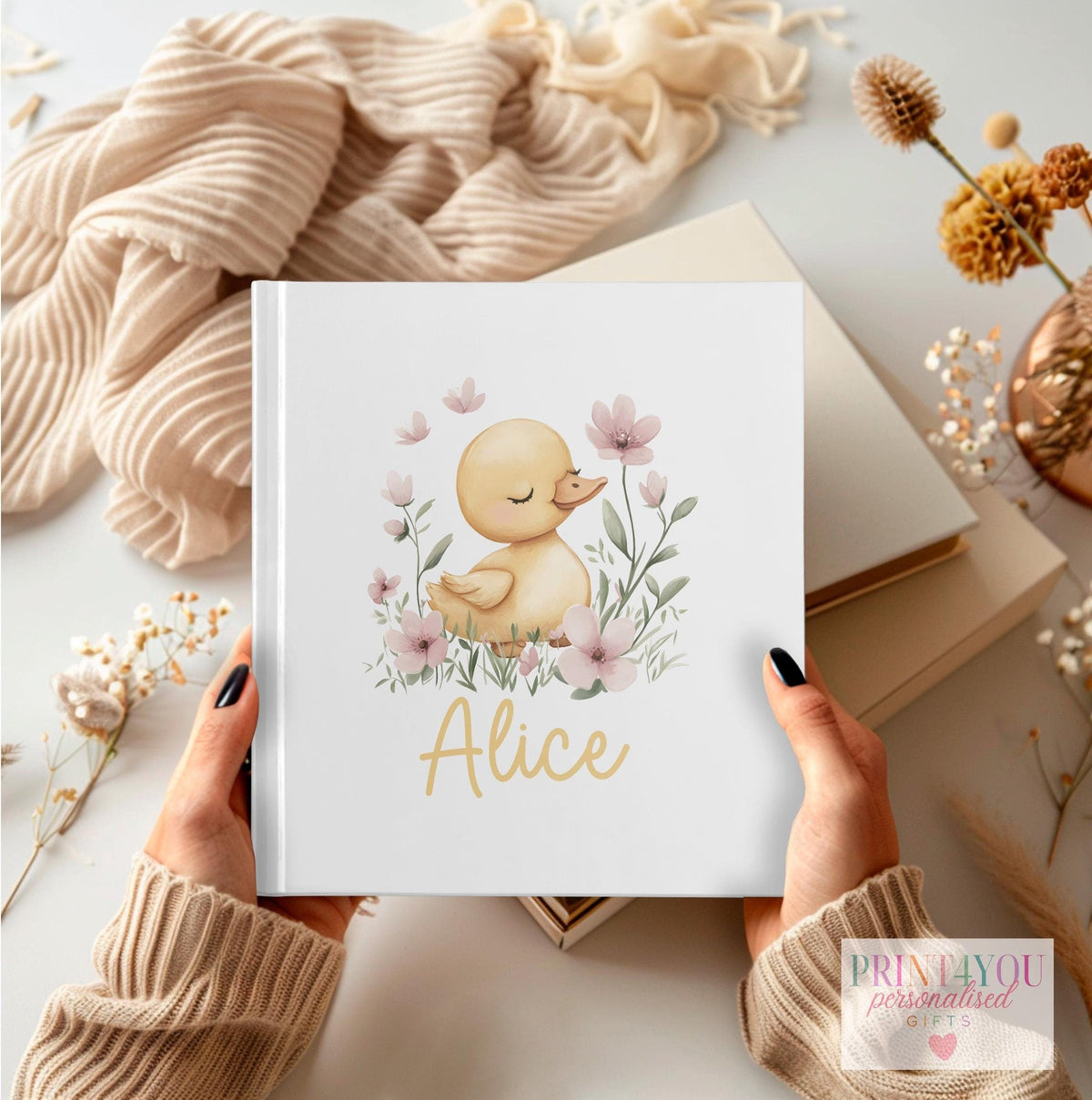 Personalised first birthday photo album with duck and flowers design and custom name on the cover