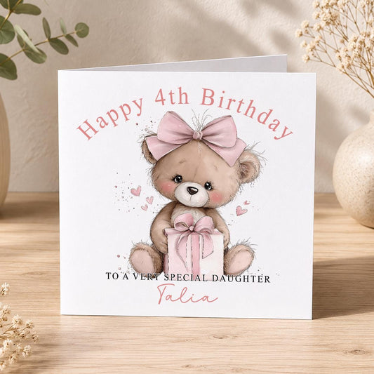 Square personalised teddy bear birthday card featuring a teddy bear holding a wrapped present