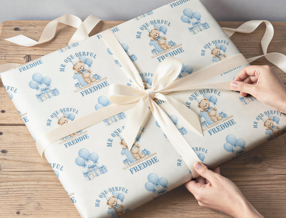 Gift wrapped in personalised Mr One-Derful teddy bear 1st birthday wrapping paper with custom name