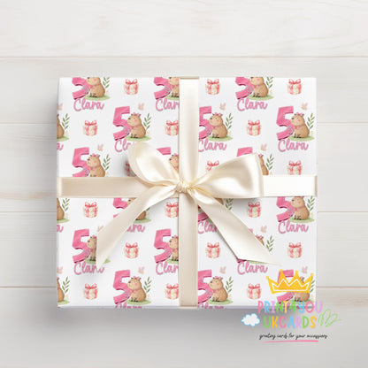 Personalised capybara birthday gift wrap sent rolled in a protective postal tube, ready for delivery.