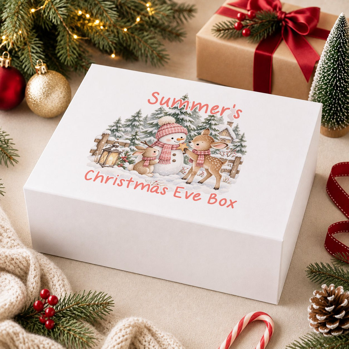 Personalised Christmas Eve box, white magnetic gift box printed with a boy in a navy bobble hat hugging a snowman and the name Archie