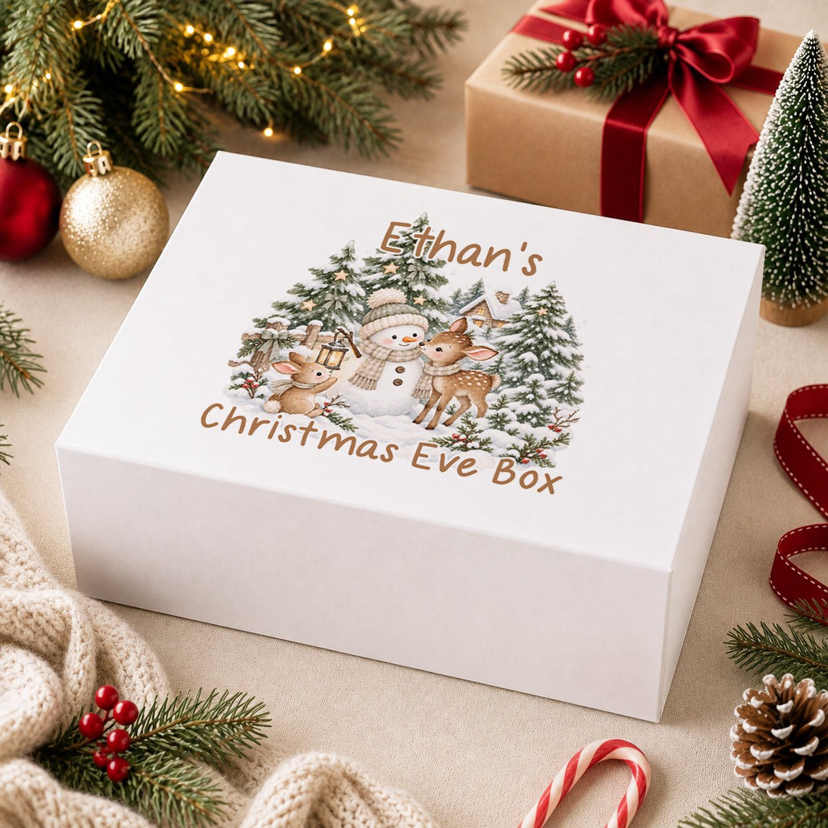 Personalised Christmas Eve box, white magnetic gift box printed with a boy in a navy jumper hugging a teddy bear by a snowy window and the name Josh