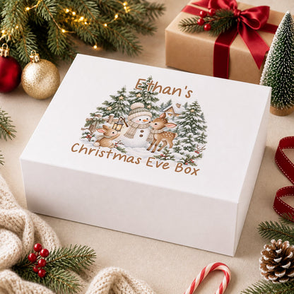 Personalised Christmas Eve box, white magnetic gift box printed with a boy in a navy jumper hugging a teddy bear by a snowy window and the name Josh